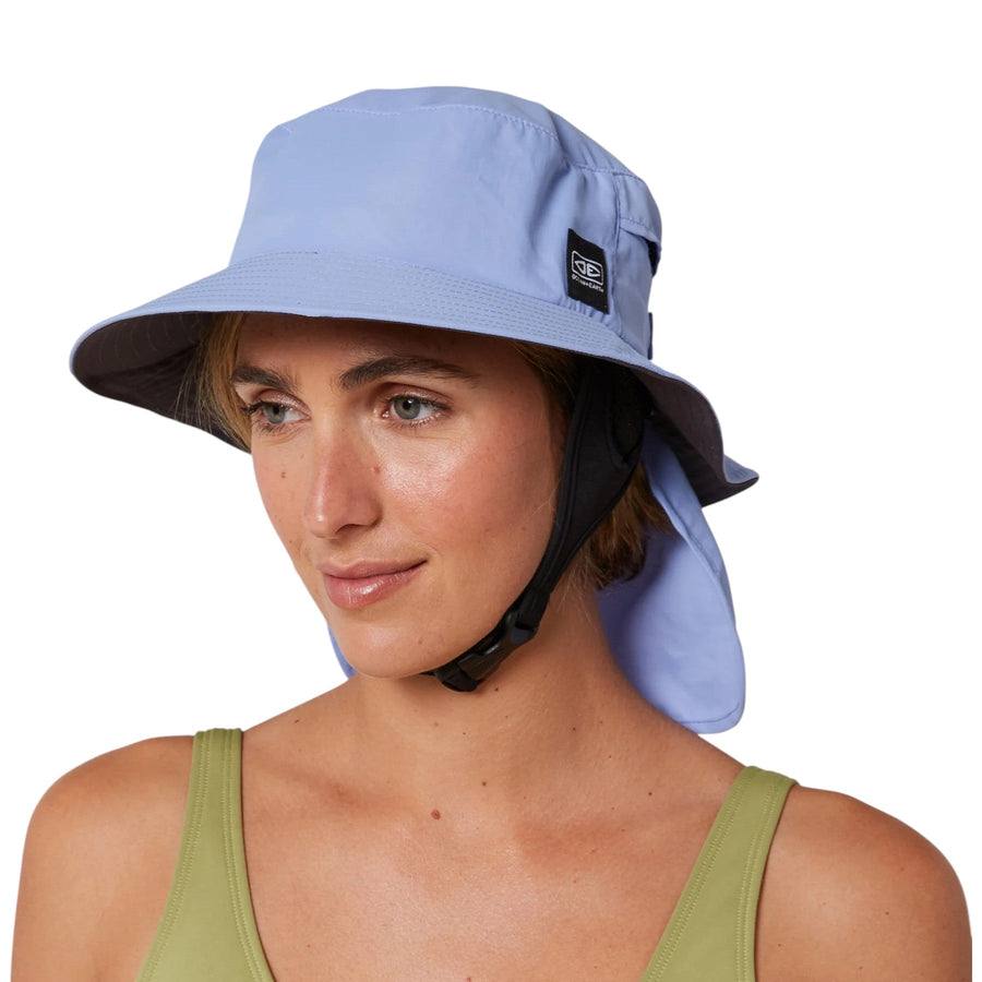 Woman wearing light blue surf hat with chin strap, displayed by Melbourne Surfboard Shop